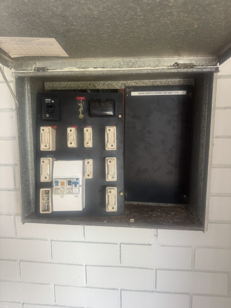 Older residential fuse box before switchboard upgrade in Perth home