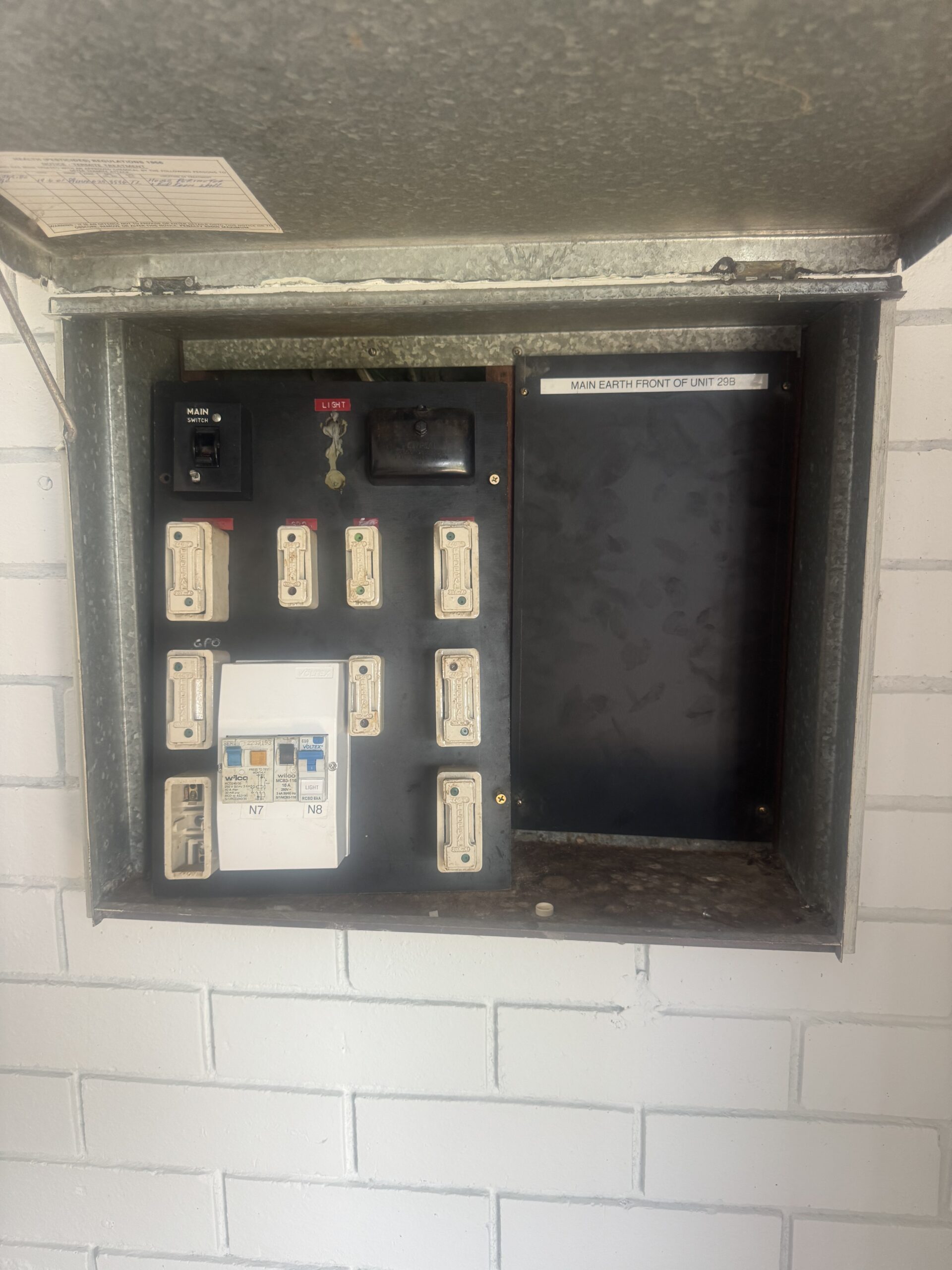 Older residential fuse box before switchboard upgrade in Perth home