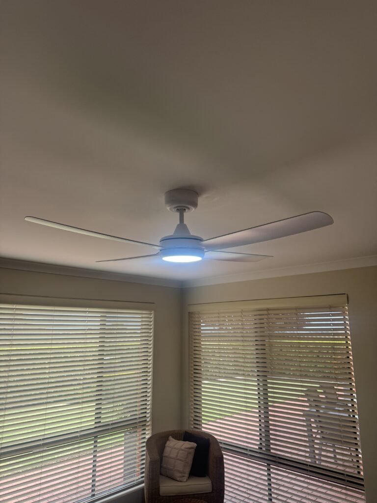 Contemporary ceiling fan with integrated LED light in residential living area