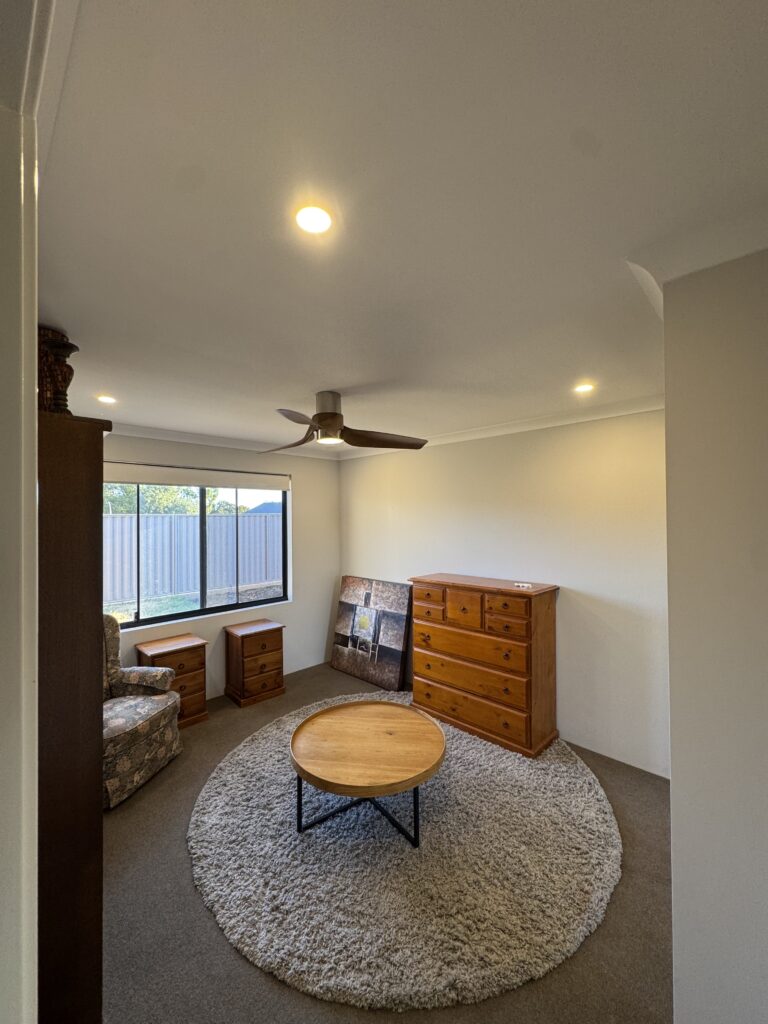 Modern room with ceiling fan and LED downlights
