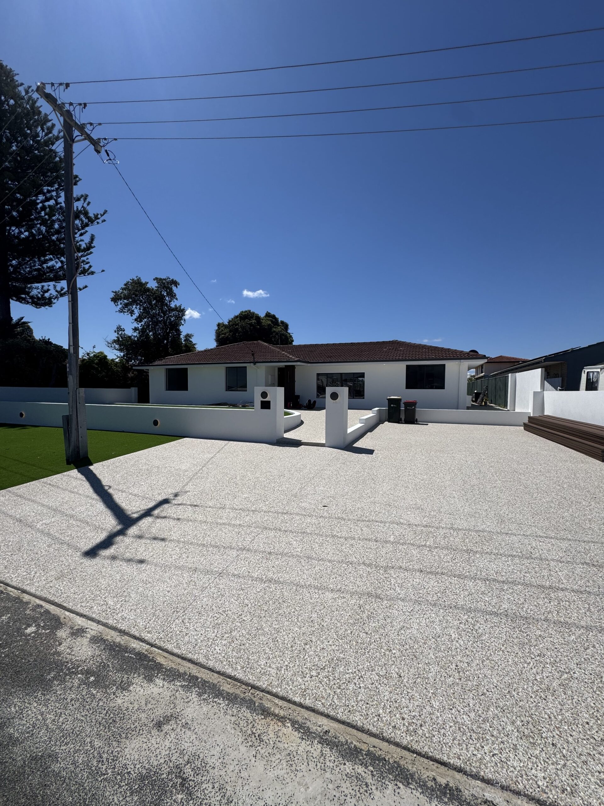 Modern residential home exterior with underground electrical connection