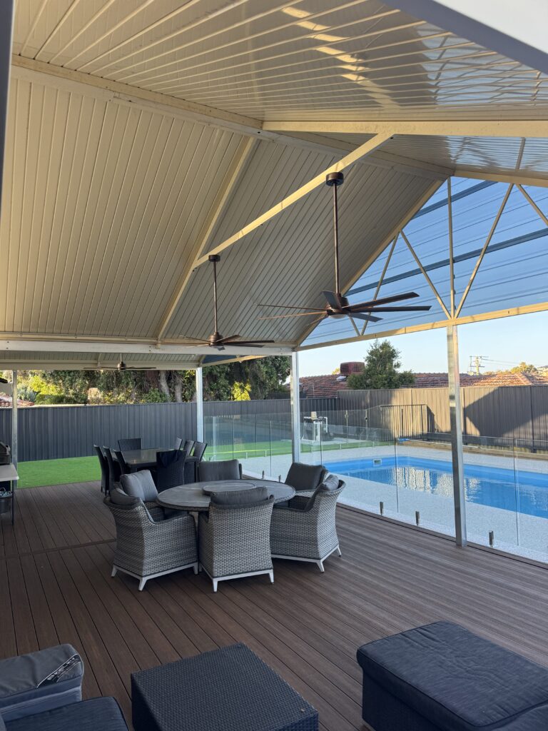 Outdoor patio area with ceiling fan installation by pool