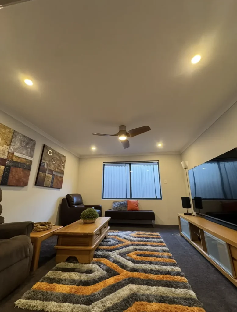 Ceiling fan and LED downlights installed in a living room
