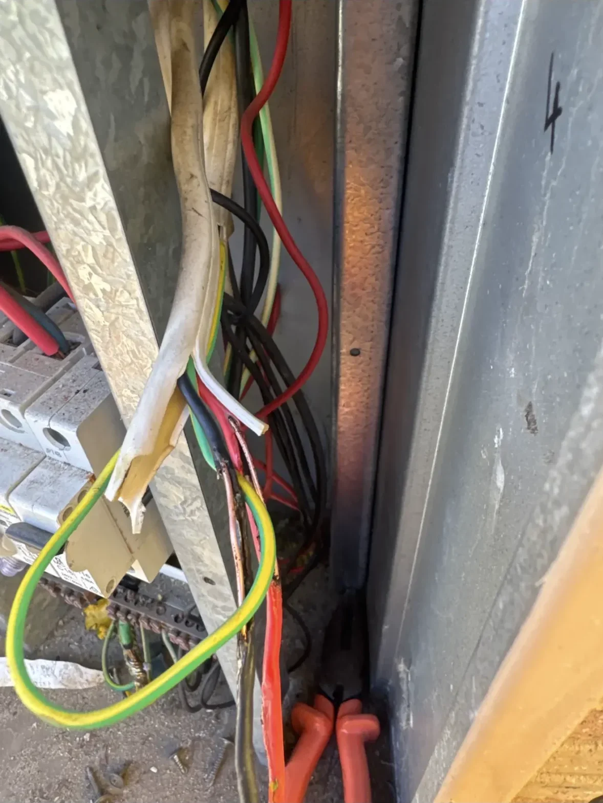 Burnt and damaged wiring inside a switchboard requiring electrical repair